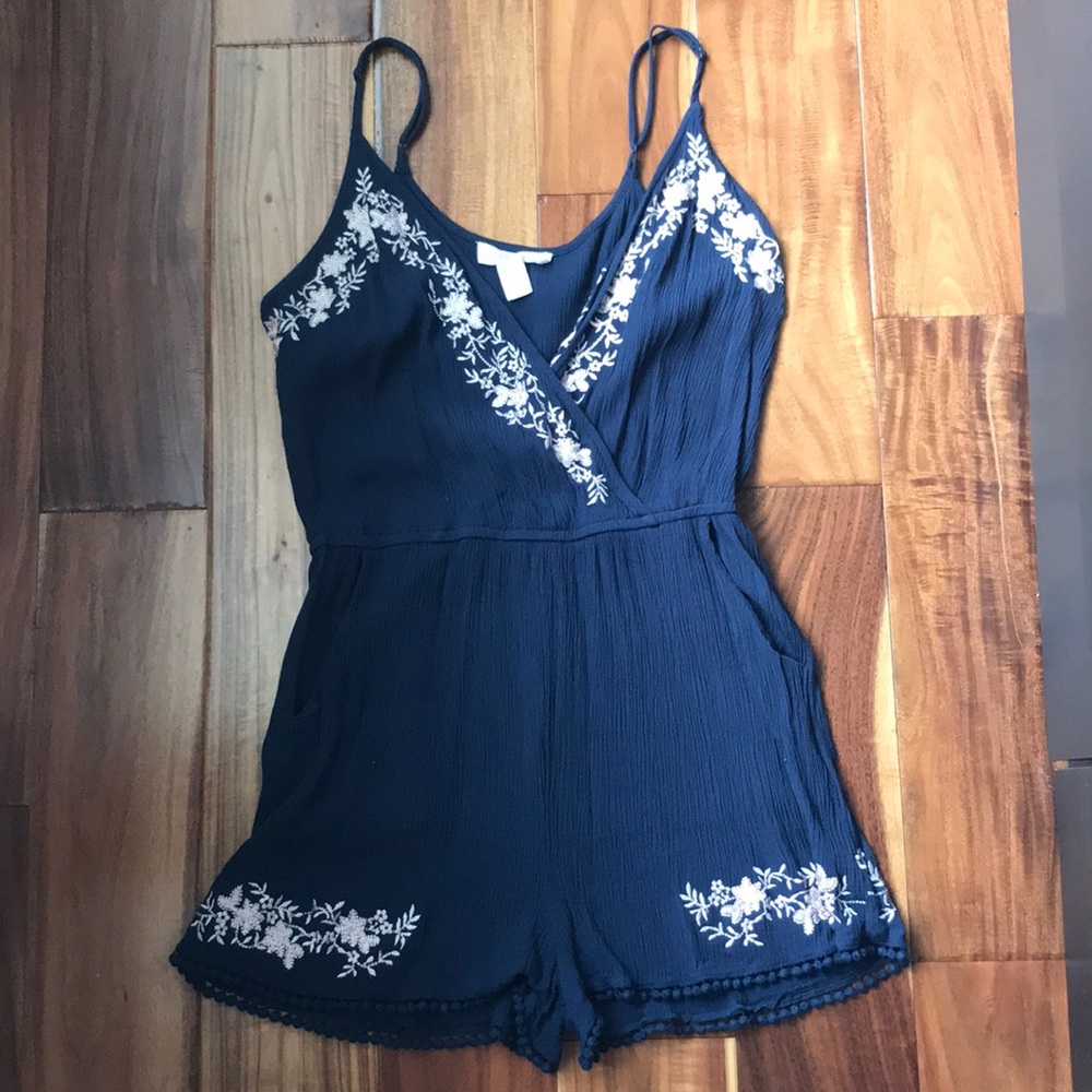 Navy blue romper with floral detail